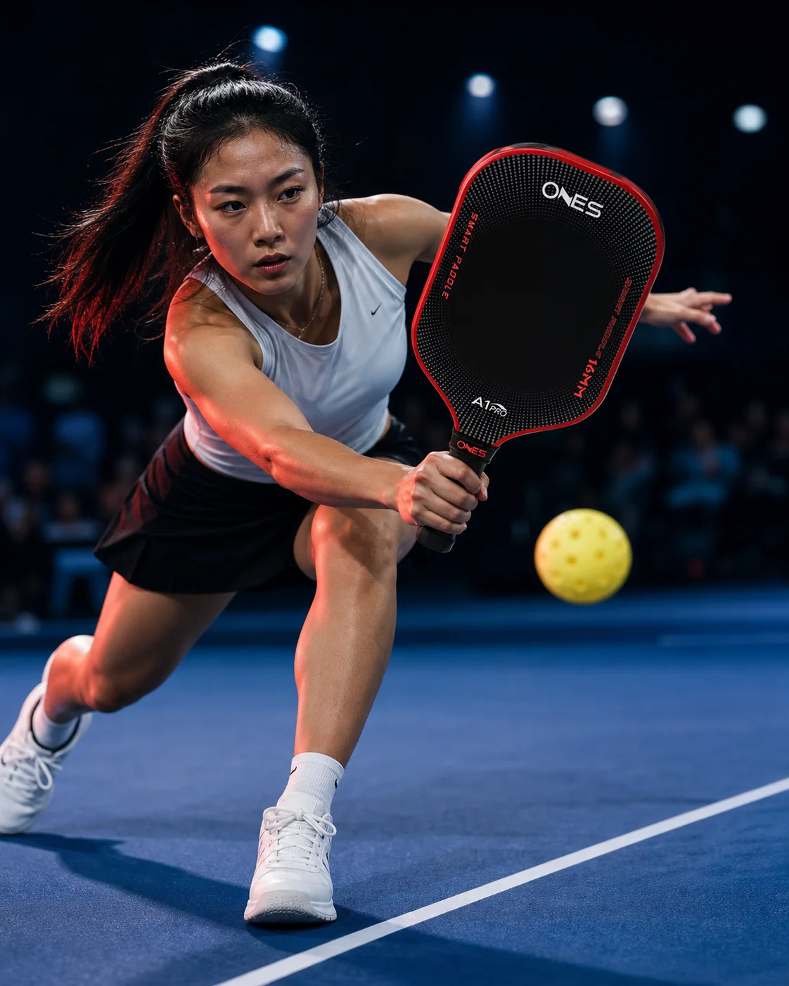 Pickleball player under match lights