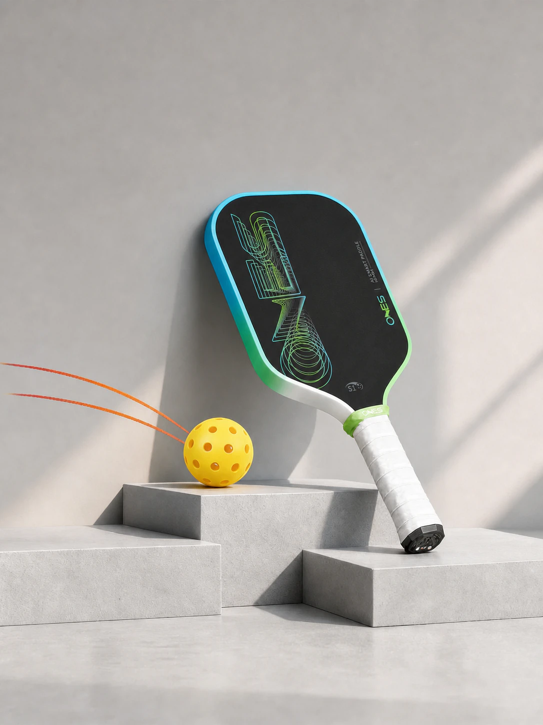 ONES S1 AI paddle and pickleball displayed on sculpted plinths